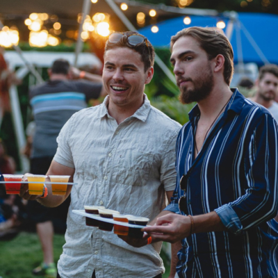 Friends holding beer tasting paddles